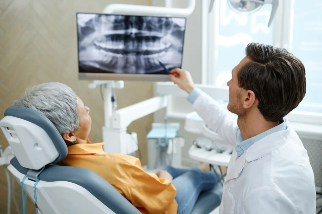 doctor showing patient X-rays
